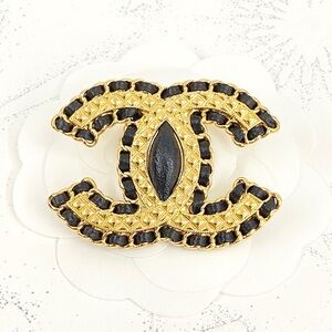 CHANEL Gold and Black Interwoven Brooch